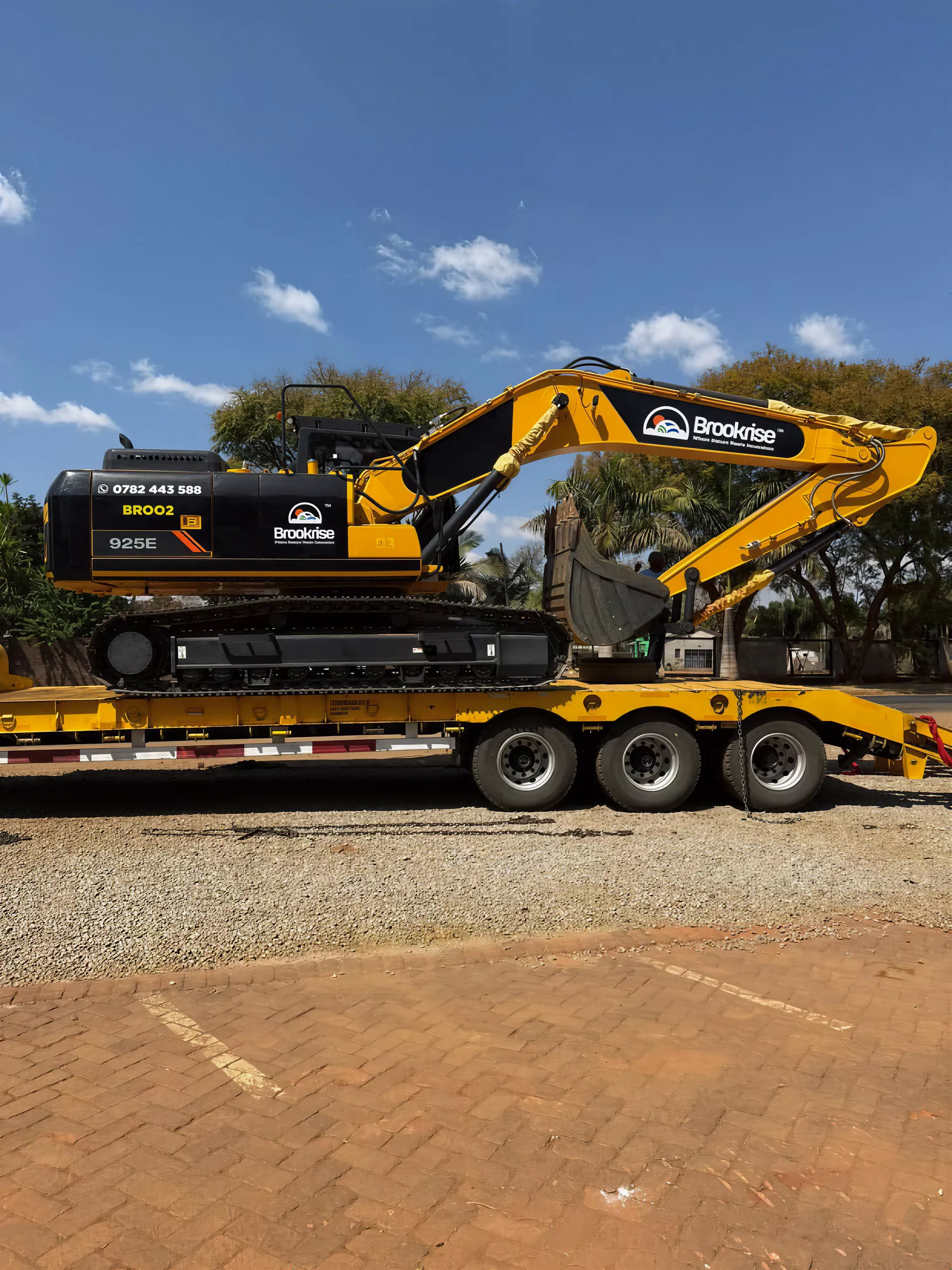 Brookrise excavator dump truck loading site wide action shot